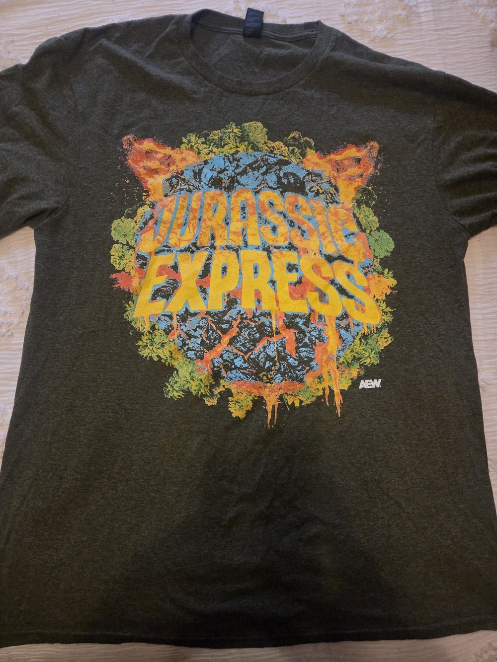 AEW RARE Jurassic Express Jungle Boy Jack Perry Luchasaurus Green Graphic Tee